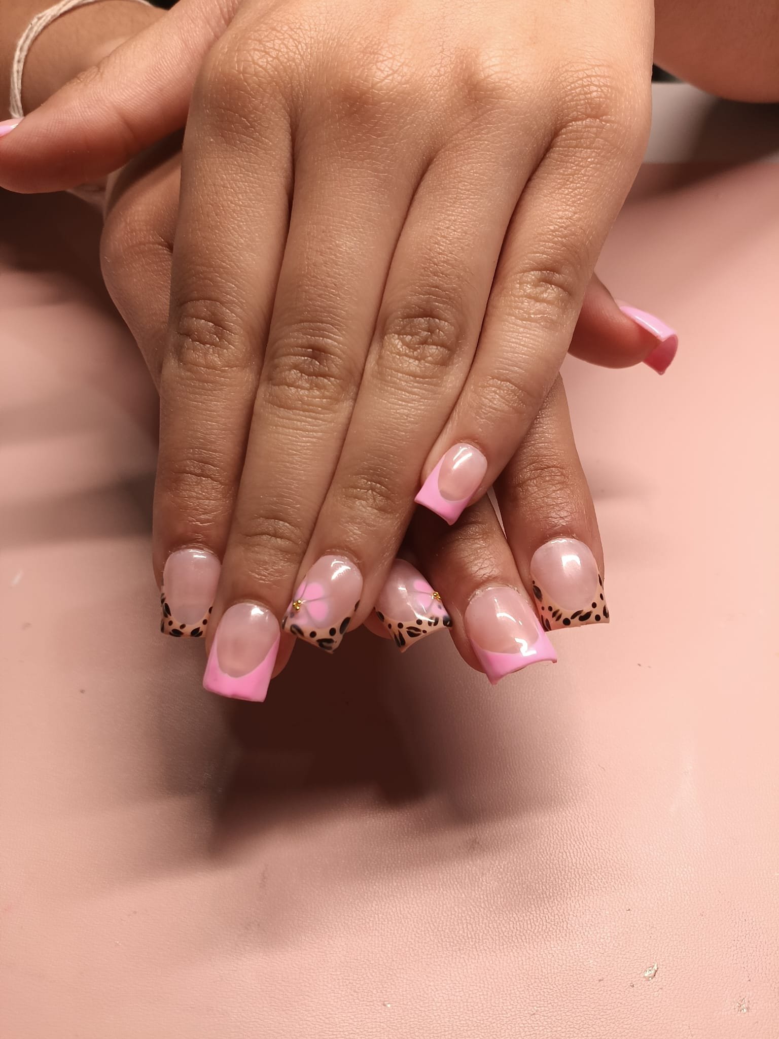 Cheetah French & Hibiscus Bloom — Sets by Ginni nail set worn on hands